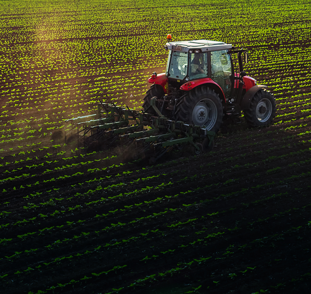 Tractor cultivating a field in spring